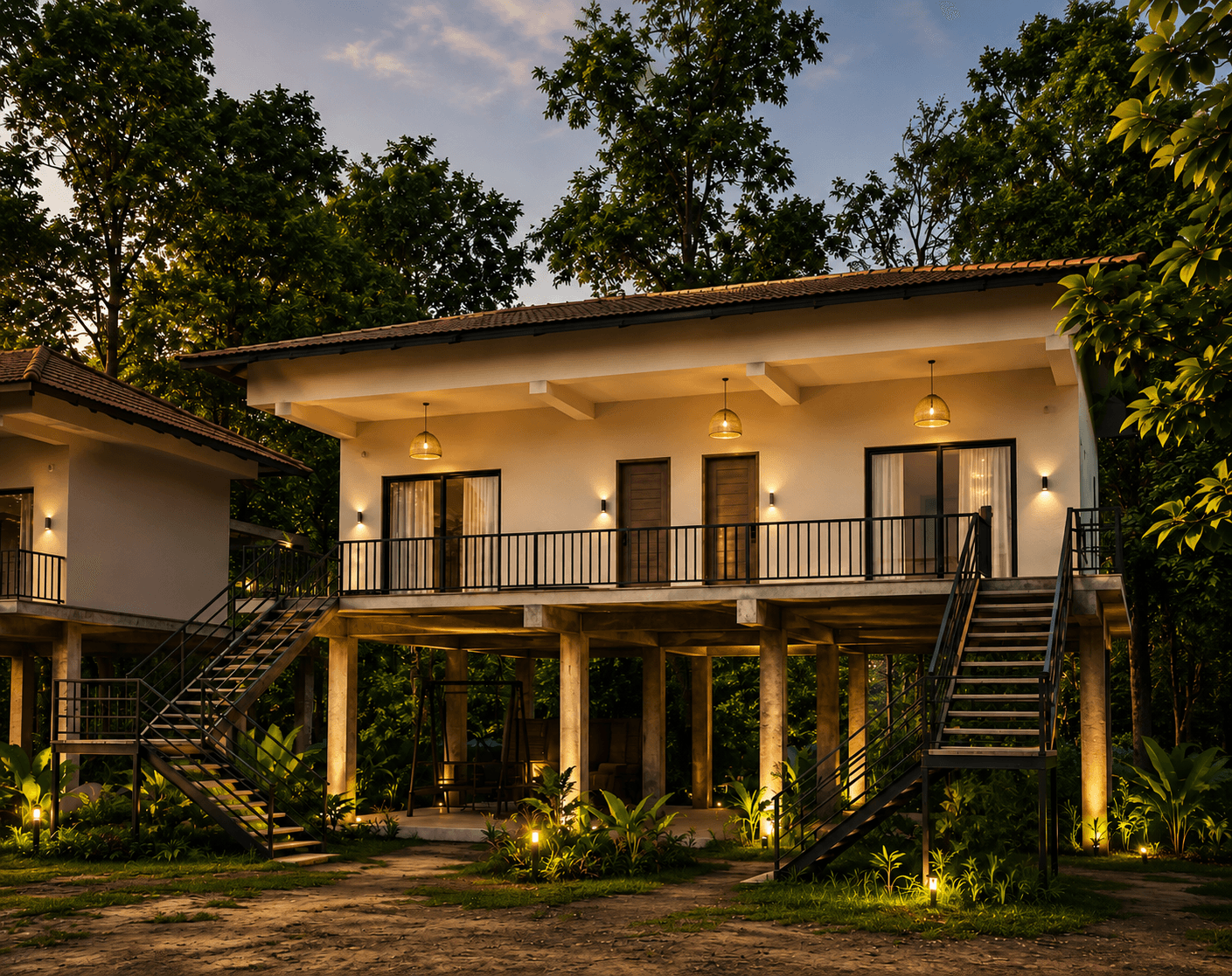 Lantern-lit cottages at Avora Wilderness Resort surrounded by Kanha forest
