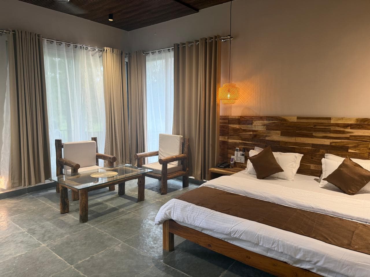 Forest Cottage room with timber textures and a sitting corner